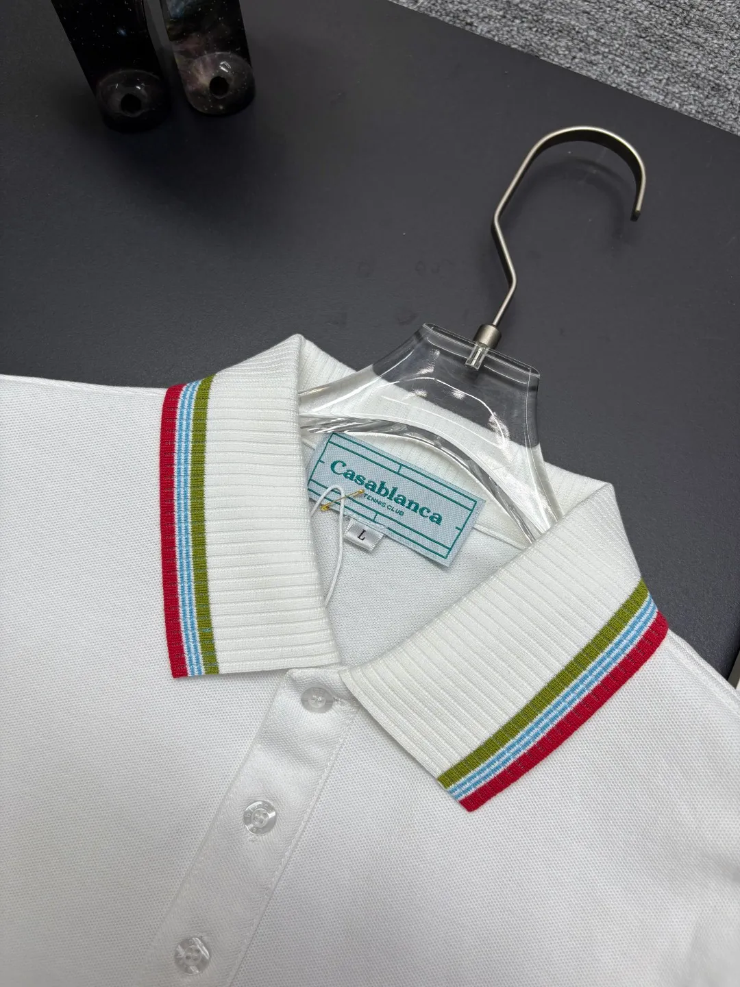 CASABLANCA New Arrival embroidered long-sleeved Polo shirt. Original fabric. Official Same Style. Made of pure cotton pique fabric, customized in the same vat. It feels very comfortable and smooth. The version is very wide and stylish. Produced by the first-line brand Factory. Imported Behringer embroidery machine. The embroidery is full and textured. The collar rib is woven with imported yarn. It will not deform after long-term wear. The most New Arrival style in spring and summer. Fashionable and individual. Super Versatile and good-looking. It is very suitable for both men and women. It is a must-have for everyone. Color: Black White Blue Size: M-3XL